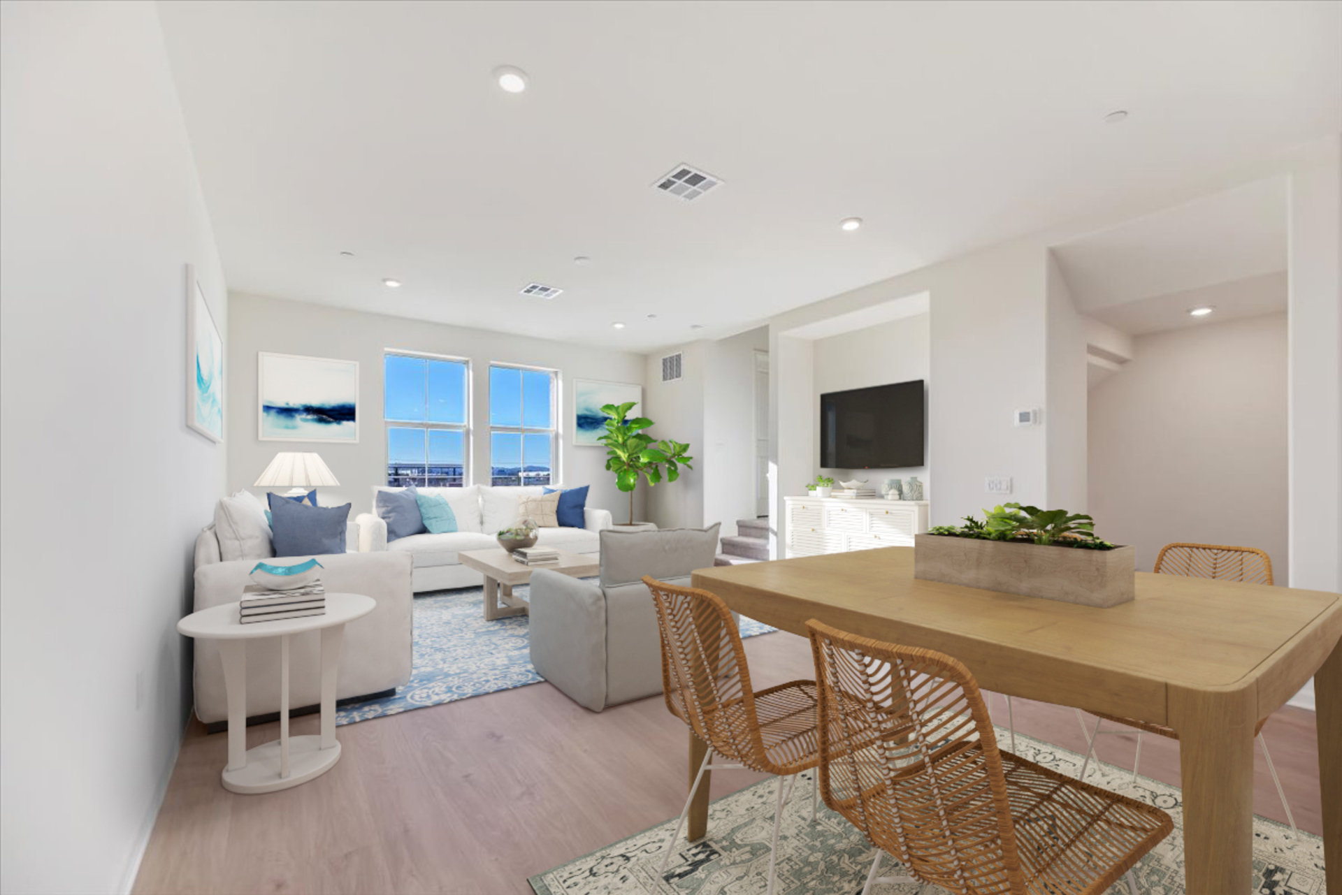 great room near dining area with neutral floors and large windows