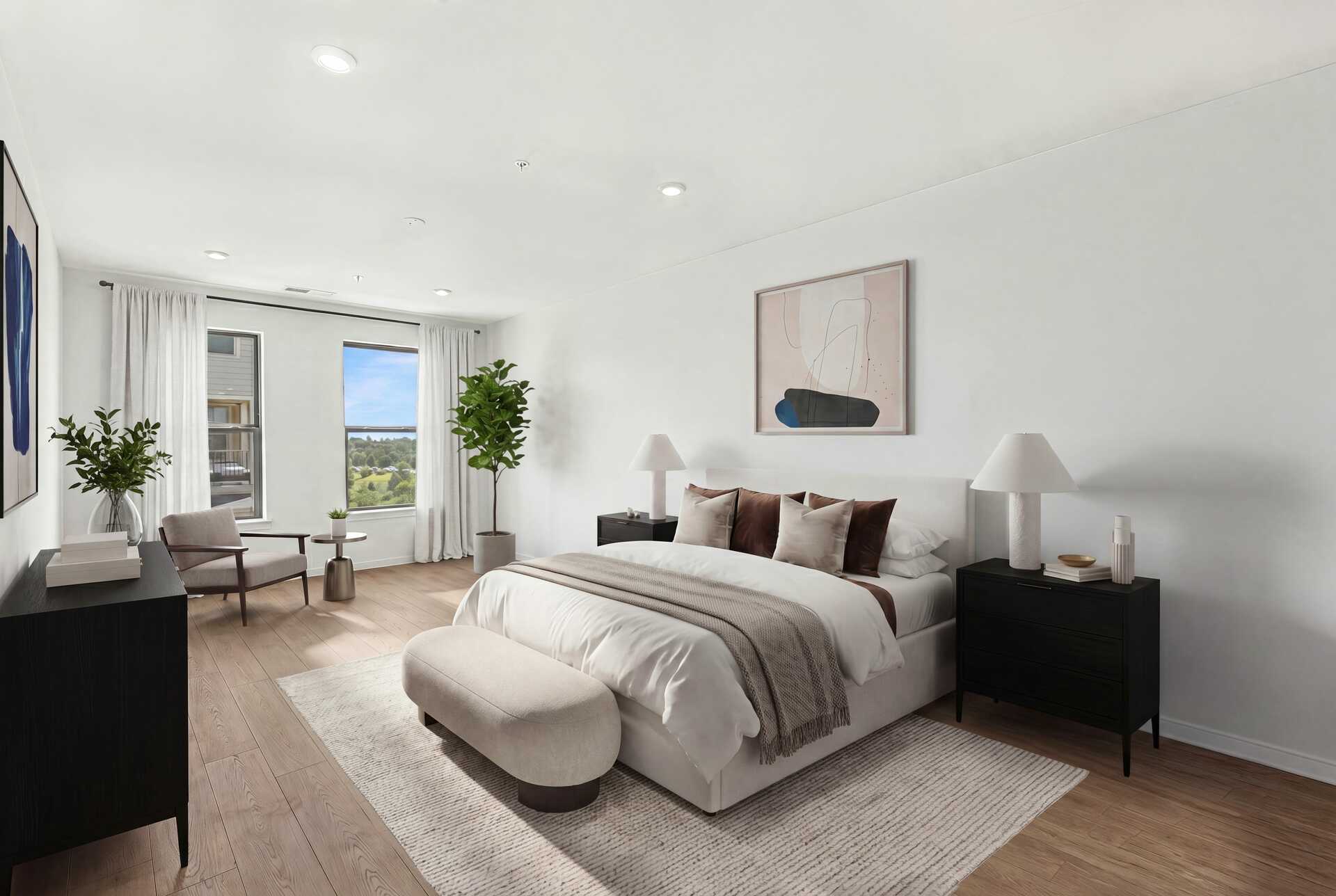 bedroom with hardwood floors windows and queen bed