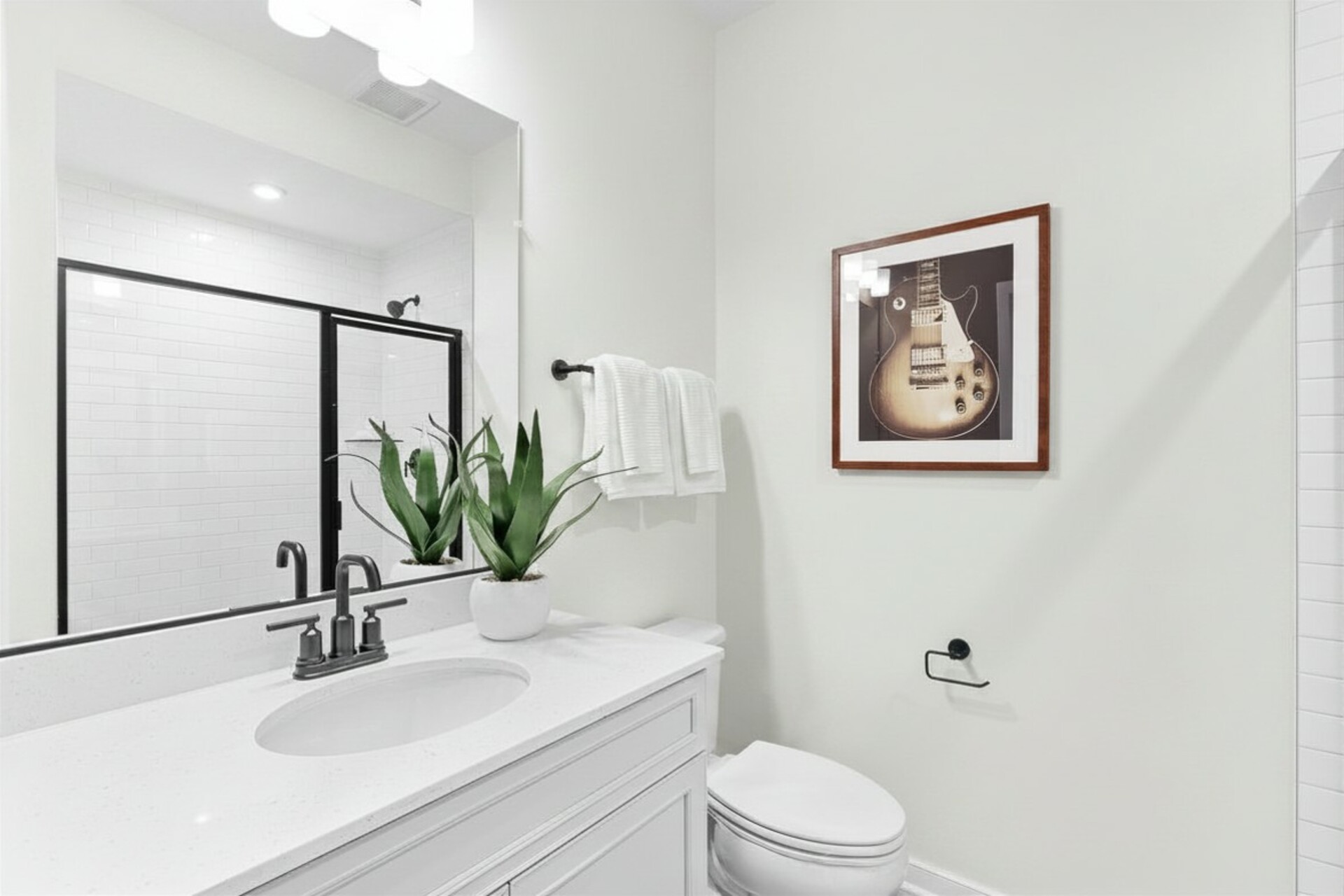 bathroom with toilet and sink with mirror