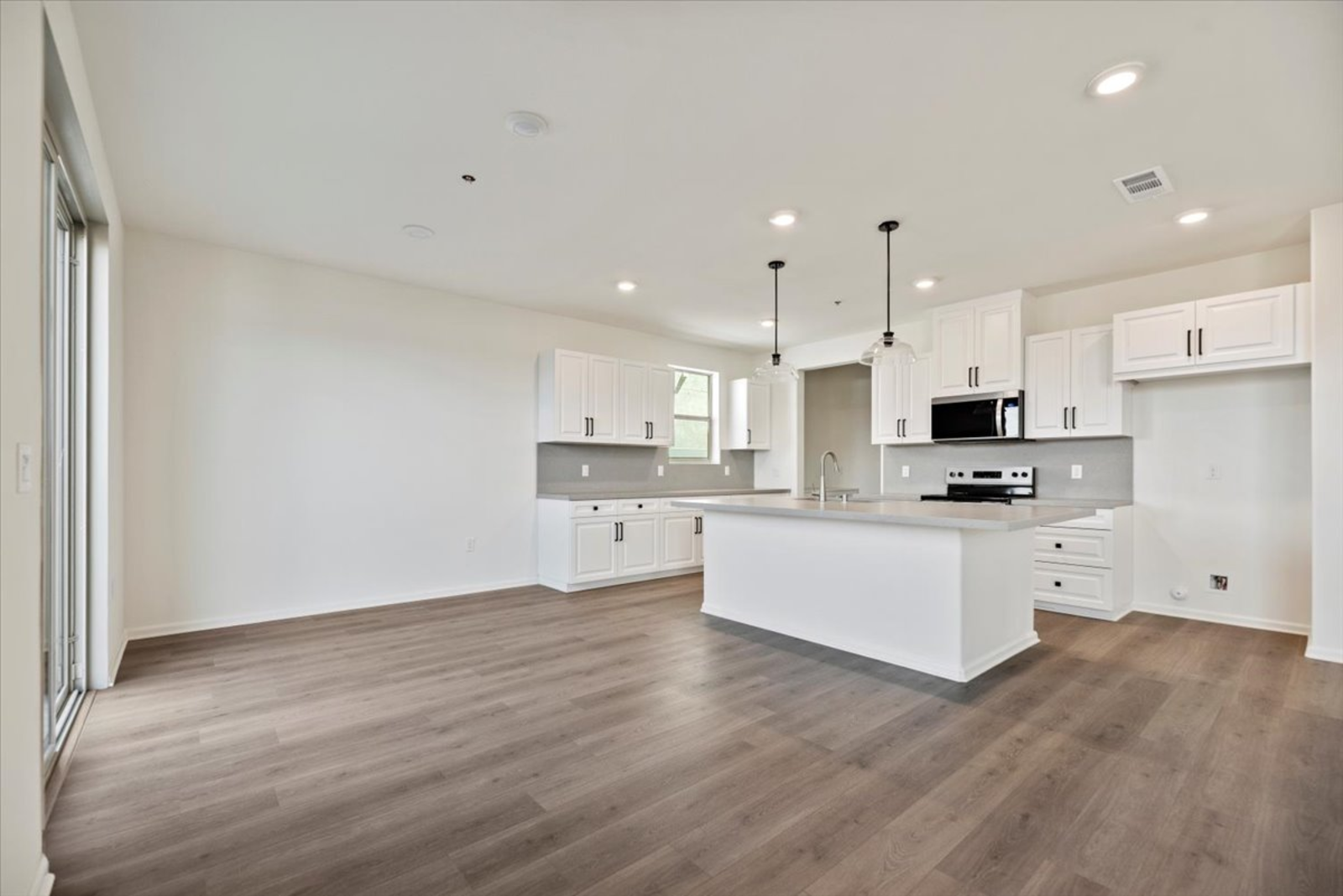 dining room with the kitchen in the background with a large island