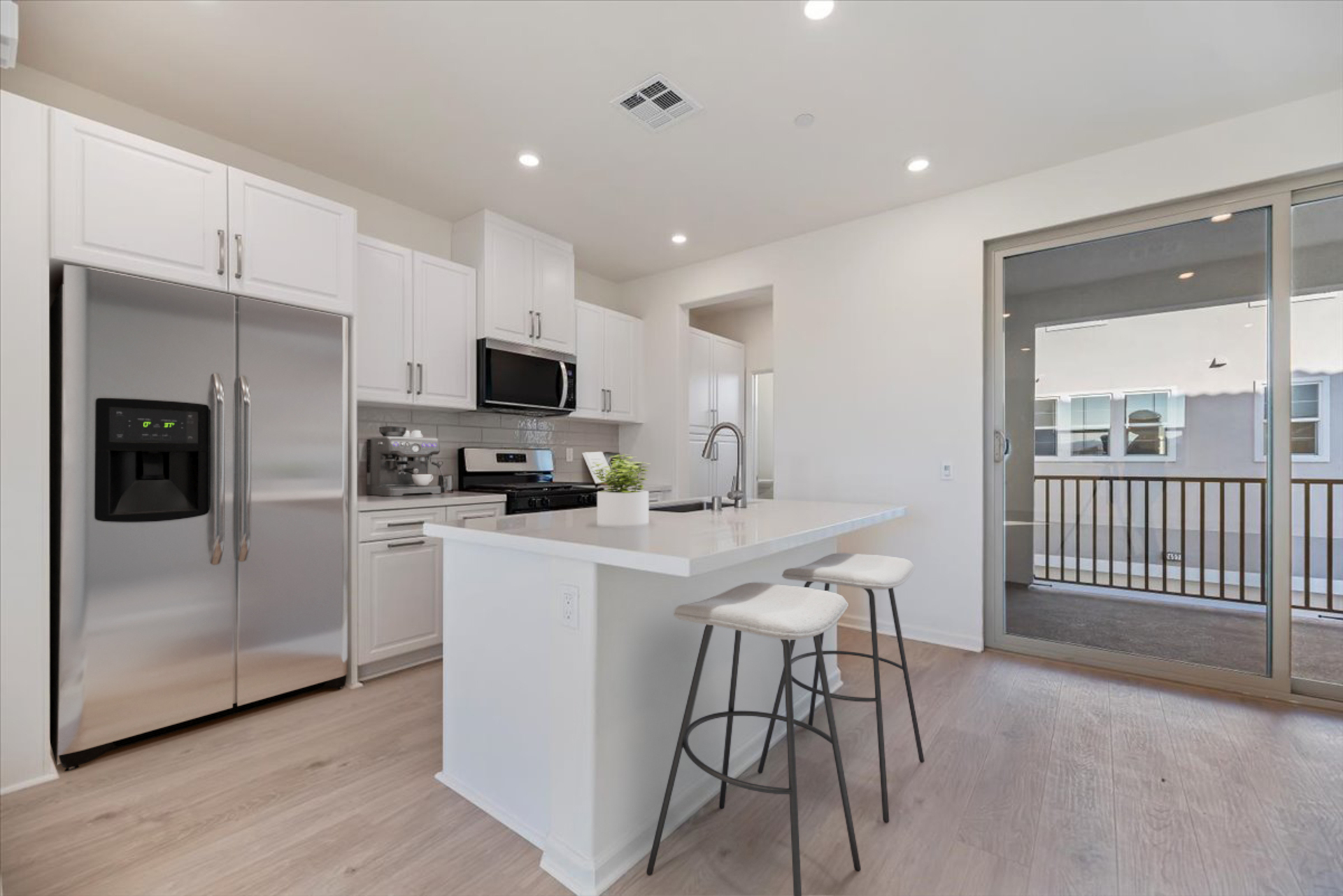 kitchen with white cabinets and countertops