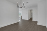 dining room with hard surface flooring and matte black light fixture