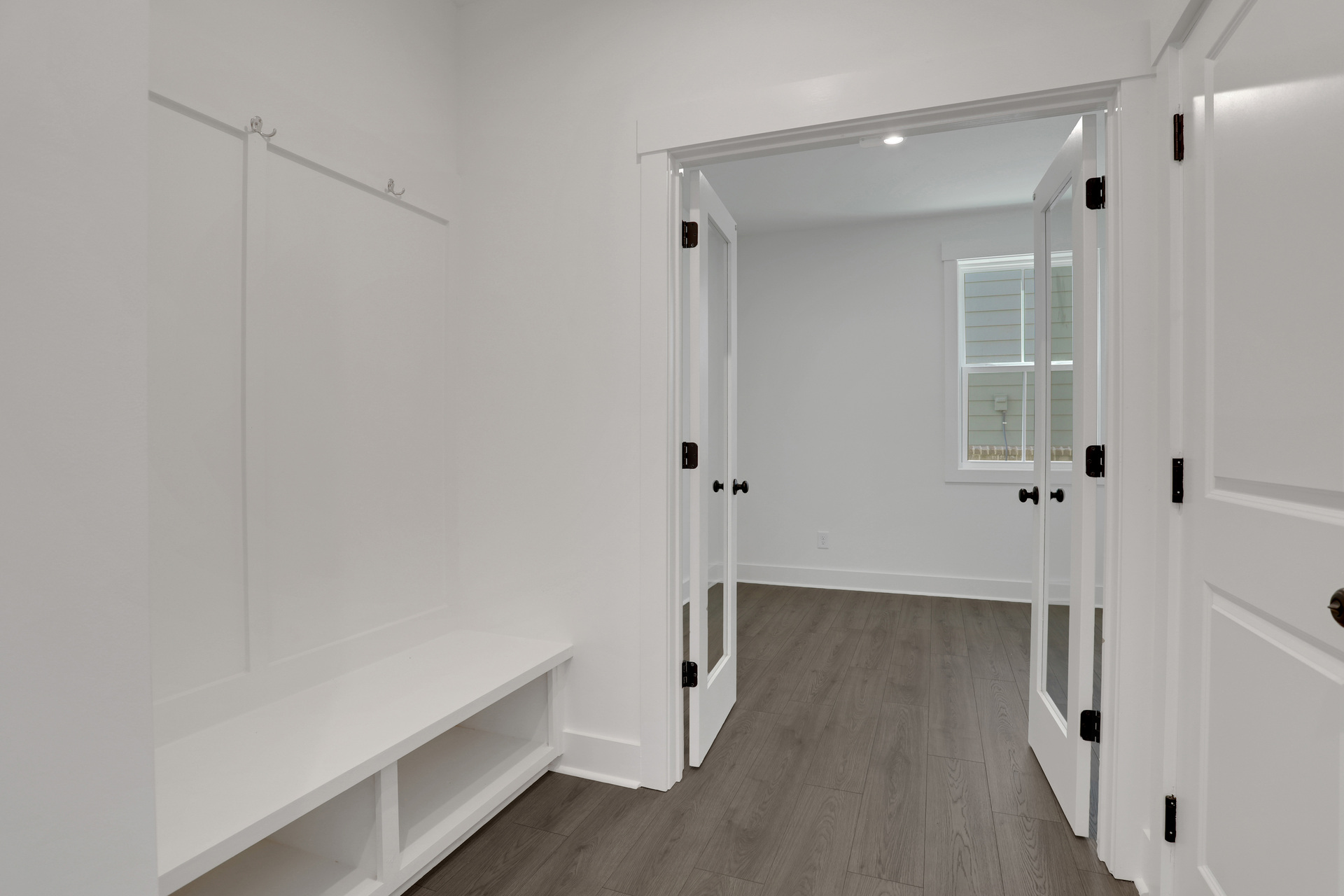 mudroom with valet leading to office