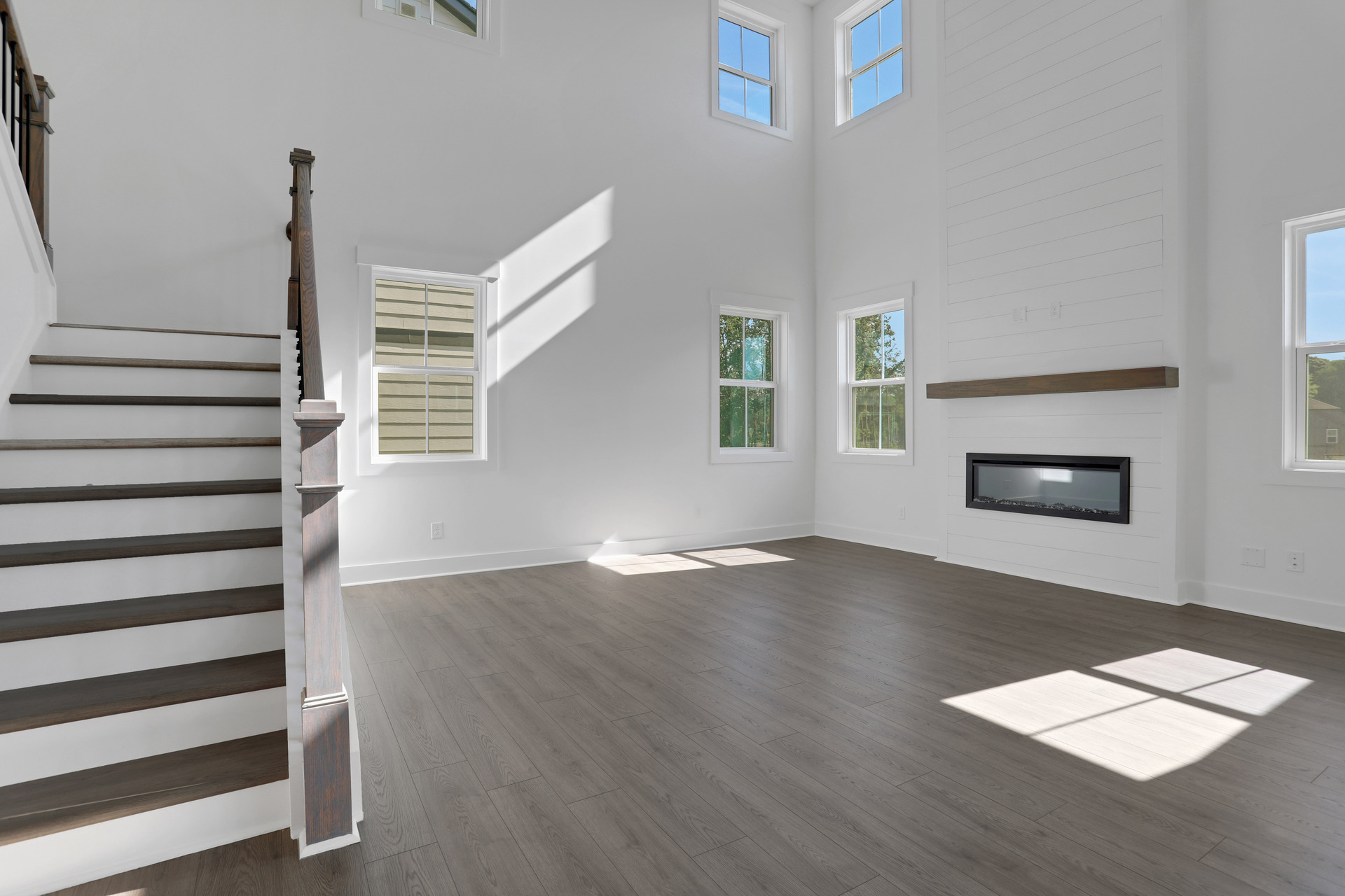 2-story great room with electric fireplace and hard surface flooring