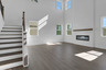 2-story great room with electric fireplace and hard surface flooring