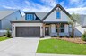 front of one-story home with dark trim and light brick