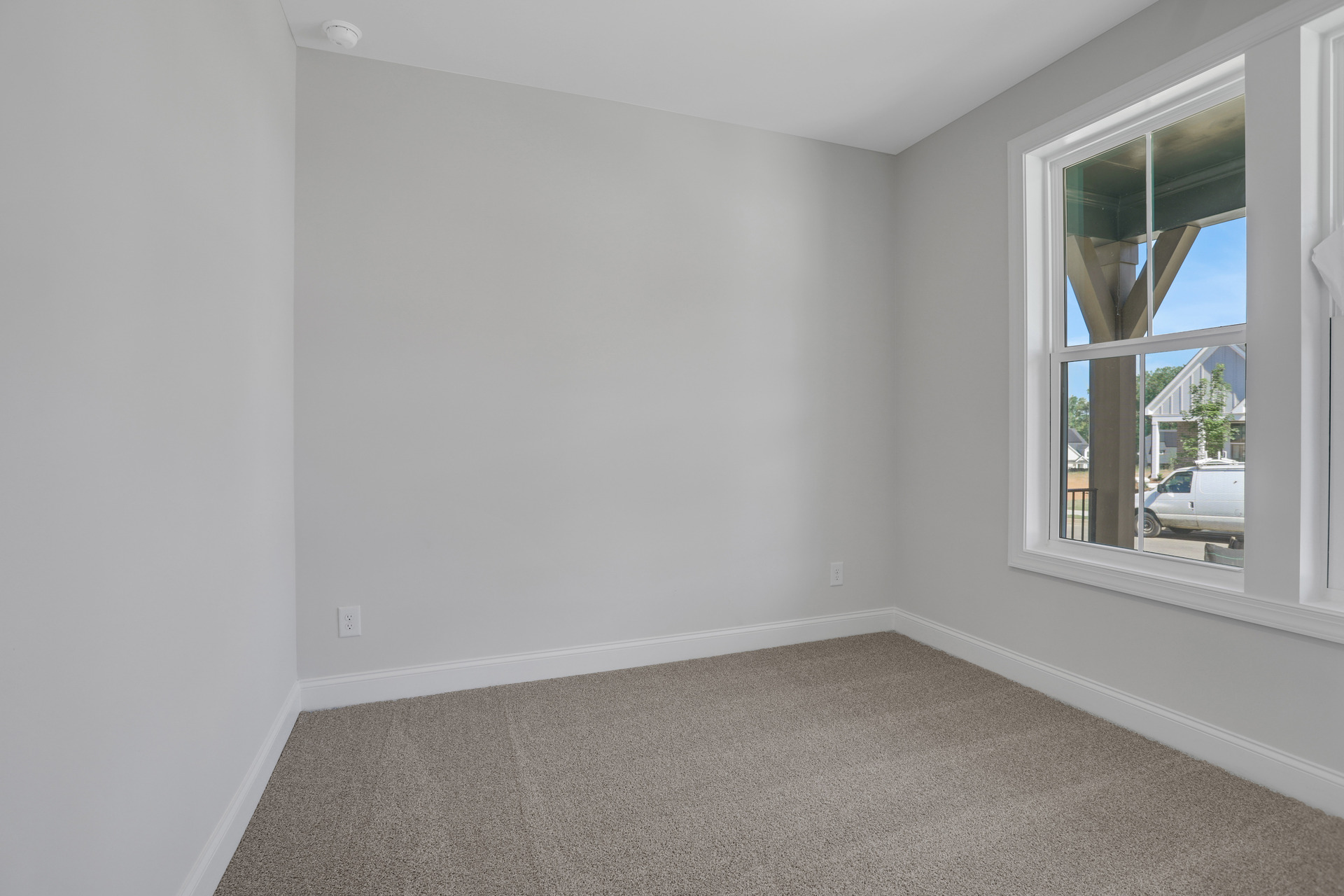 bedroom with windows and carpets