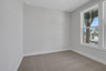 bedroom with windows and carpets
