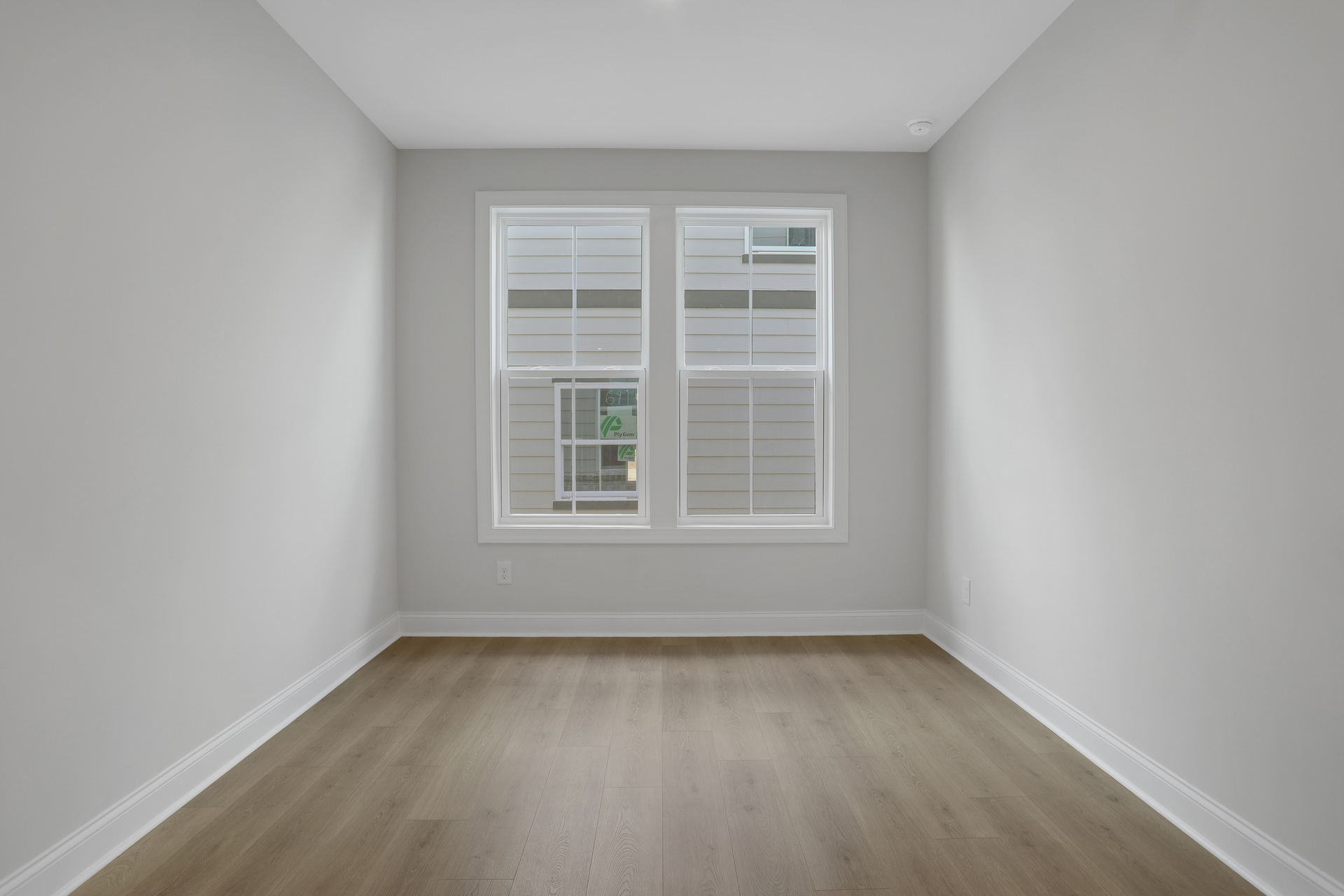 loft with hard surface flooring and windows