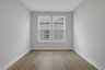 loft with hard surface flooring and windows