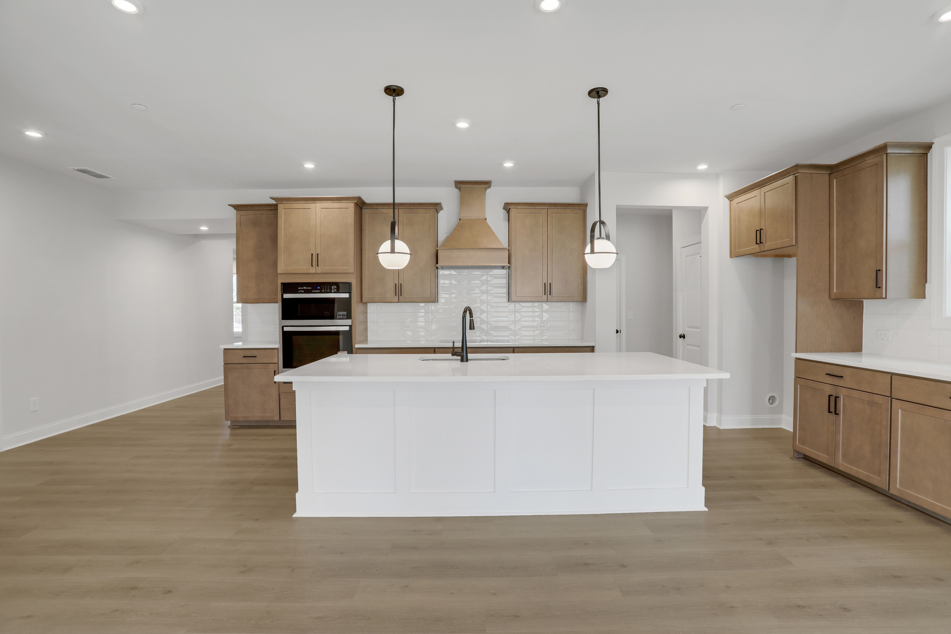 kitchen with wood-finish cabinets and quartz counters