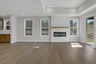 great room with electric fireplace and hard surface flooring