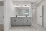 primary bathroom with gray cabinets and tile flooring