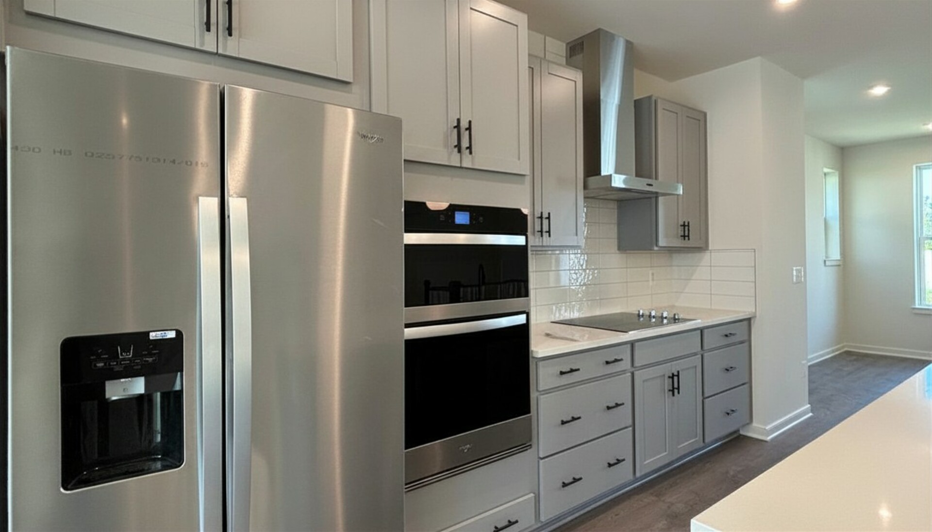 kitchen with gray cabinets and stainless steel appliances