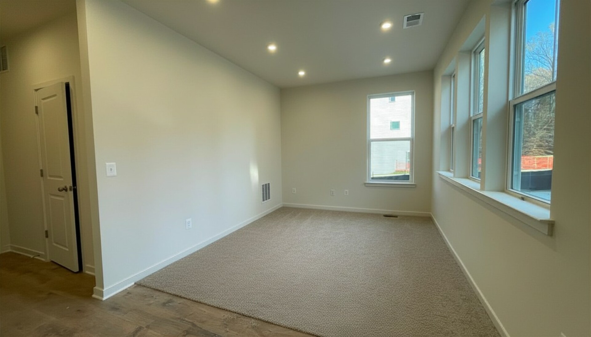 recreation room with carpet and lots of natural light