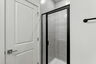 walk in shower and tiles and cabinets