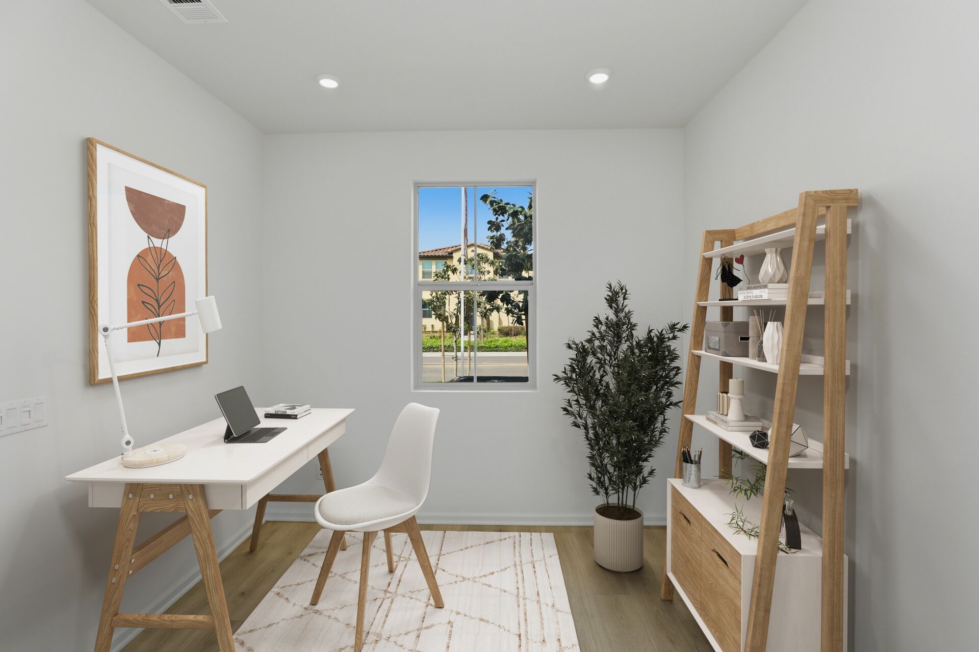 study with neutral floors and large window