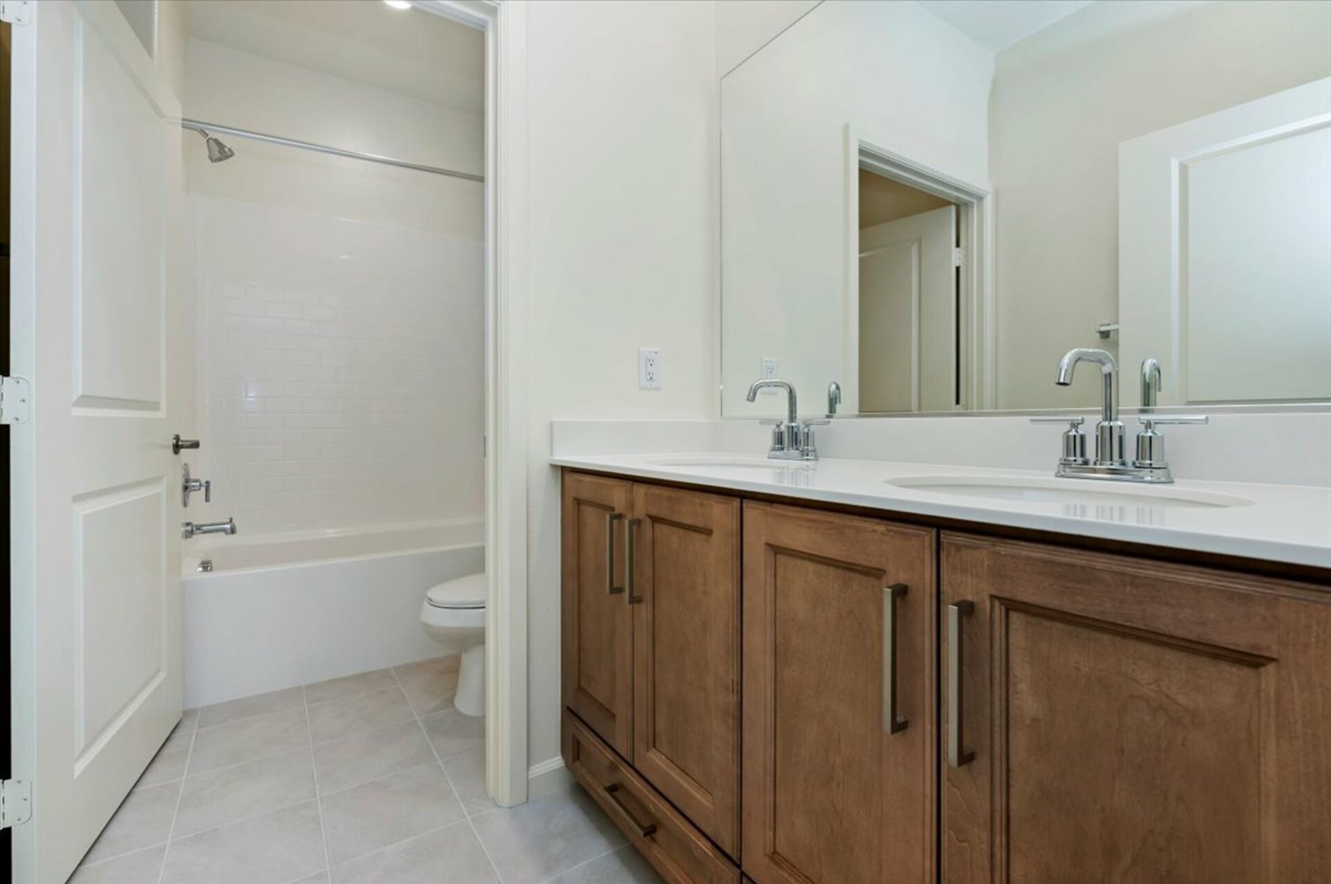 bathroom with neutral floors and white countertops
