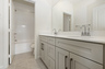 bathroom with neutral floors and white countertops