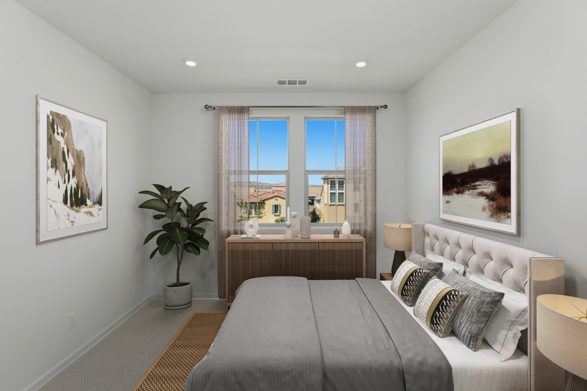 primary bedroom with neutral carpet and large window
