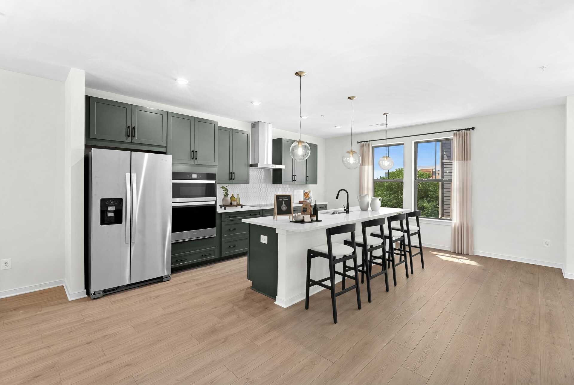 kitchen island with green countertops and stainless steel
