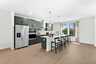 kitchen island with green countertops and stainless steel