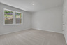 bedroom with windows and carpet