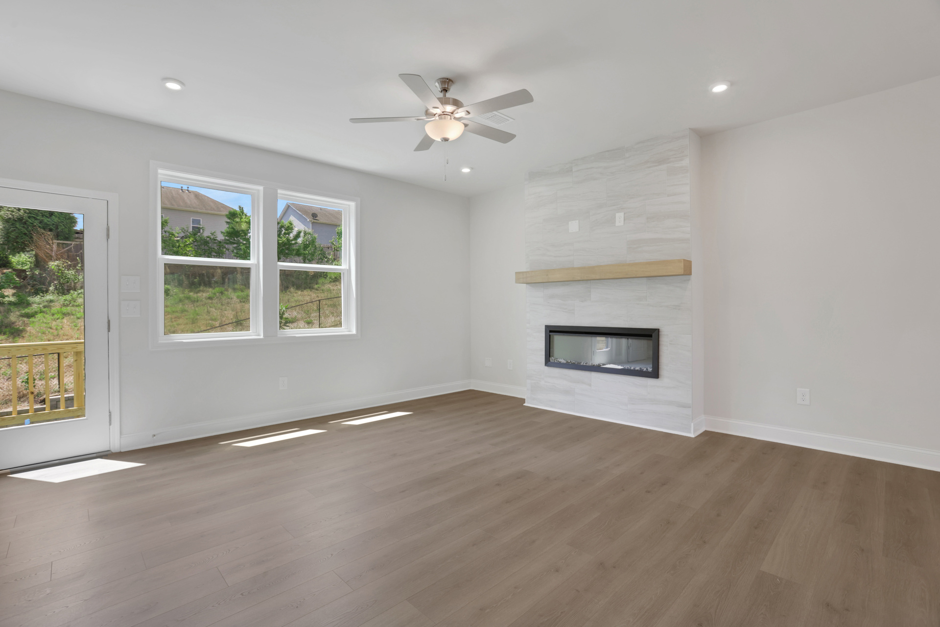 great room with electric fireplace and hard surface flooring
