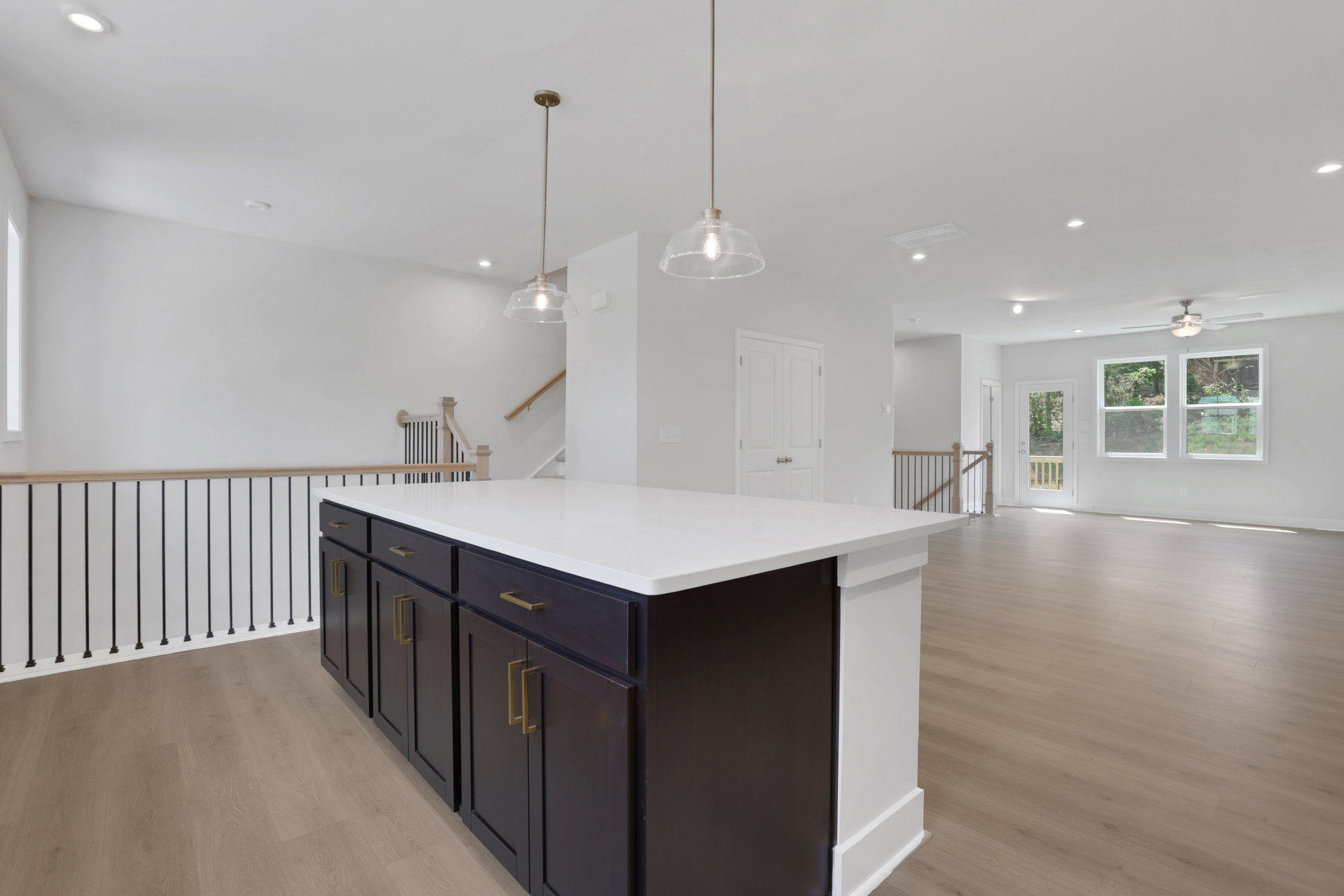 dining room with hard surface flooring open to kitchen and great room