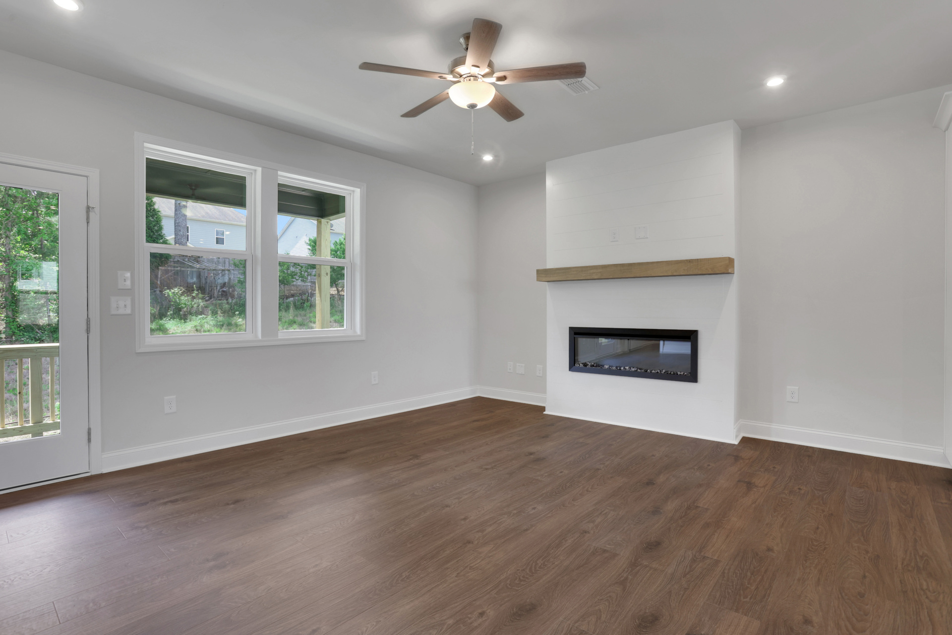 great room with electric fireplace and hard surface flooring