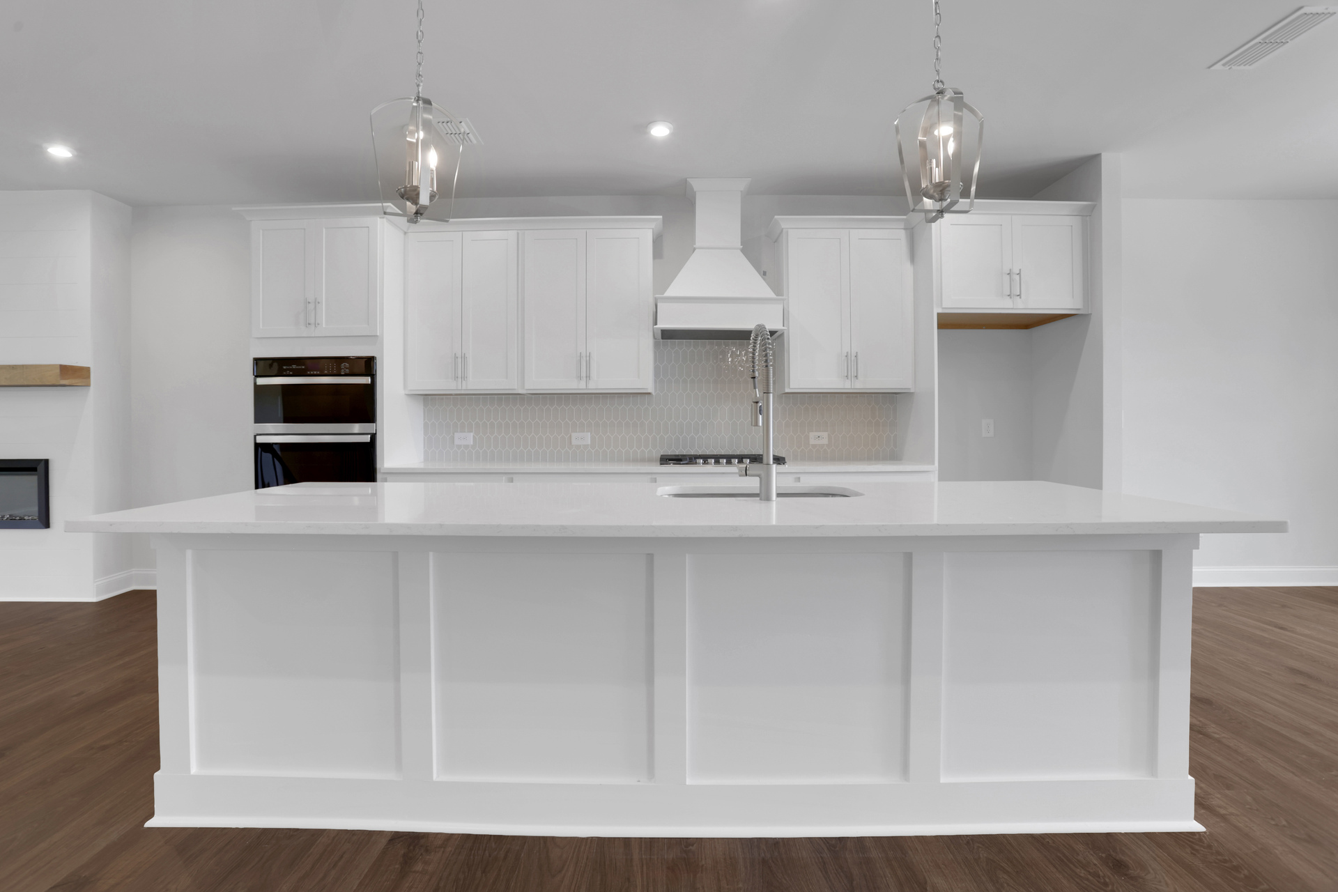 kitchen with white cabinets and quartz counters