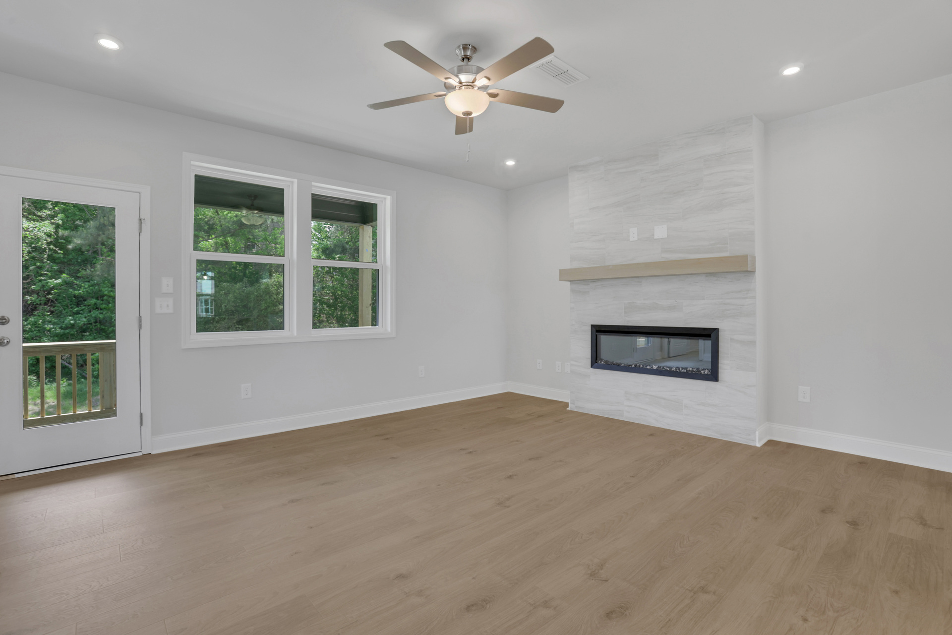 great room with electric fireplace and hard surface flooring