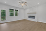 great room with electric fireplace and hard surface flooring