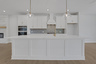 kitchen with white cabinets and quartz counters