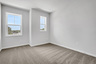 bedroom with windows and carpet