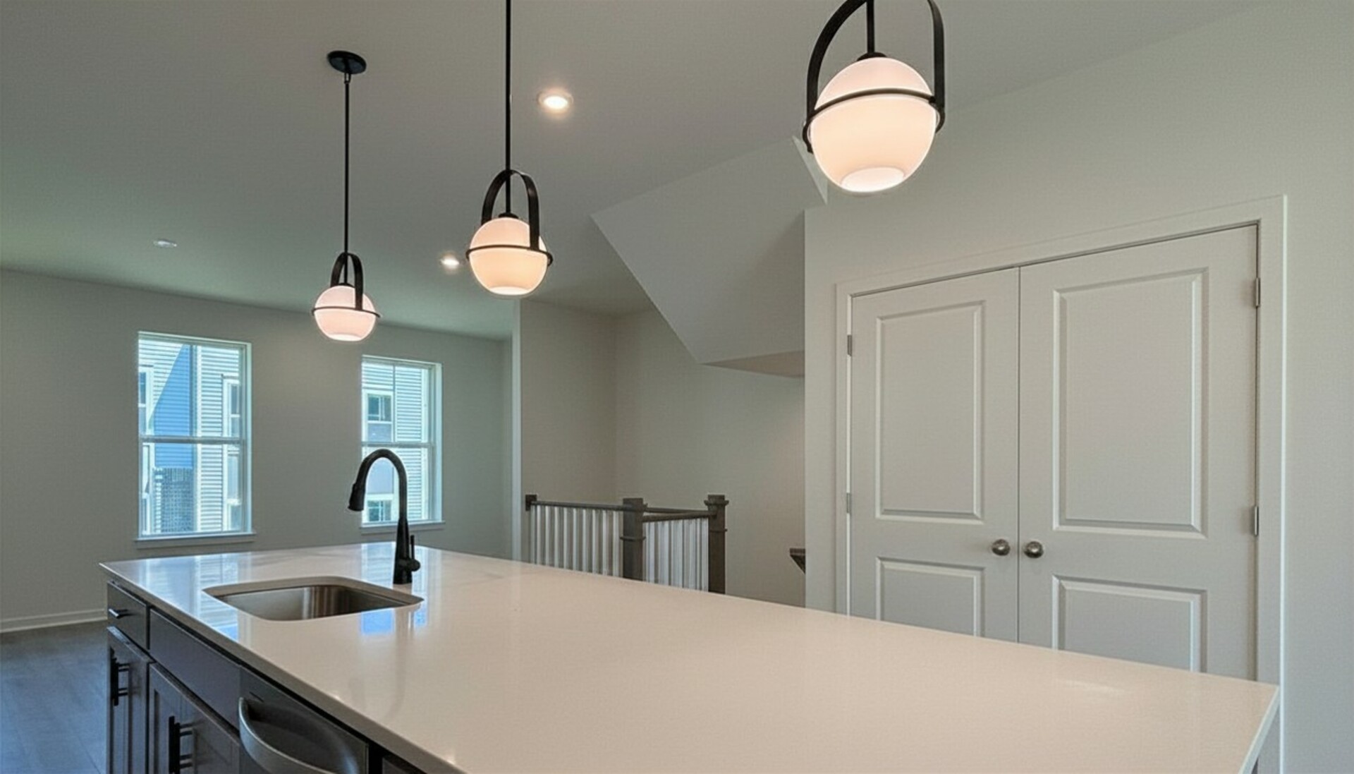 large white kitchen island and pendant lighting