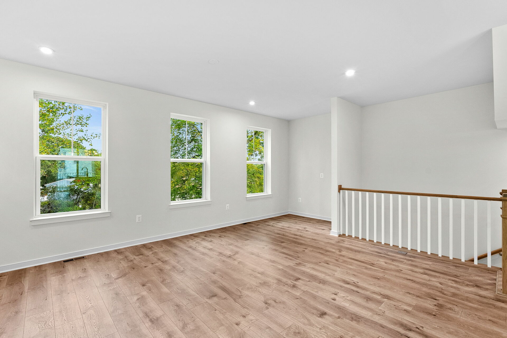living room with hardwood floors and natural light with windows