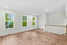 living room with hardwood floors and natural light with windows
