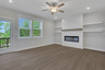 great room with electric fireplace and hard-surface flooring