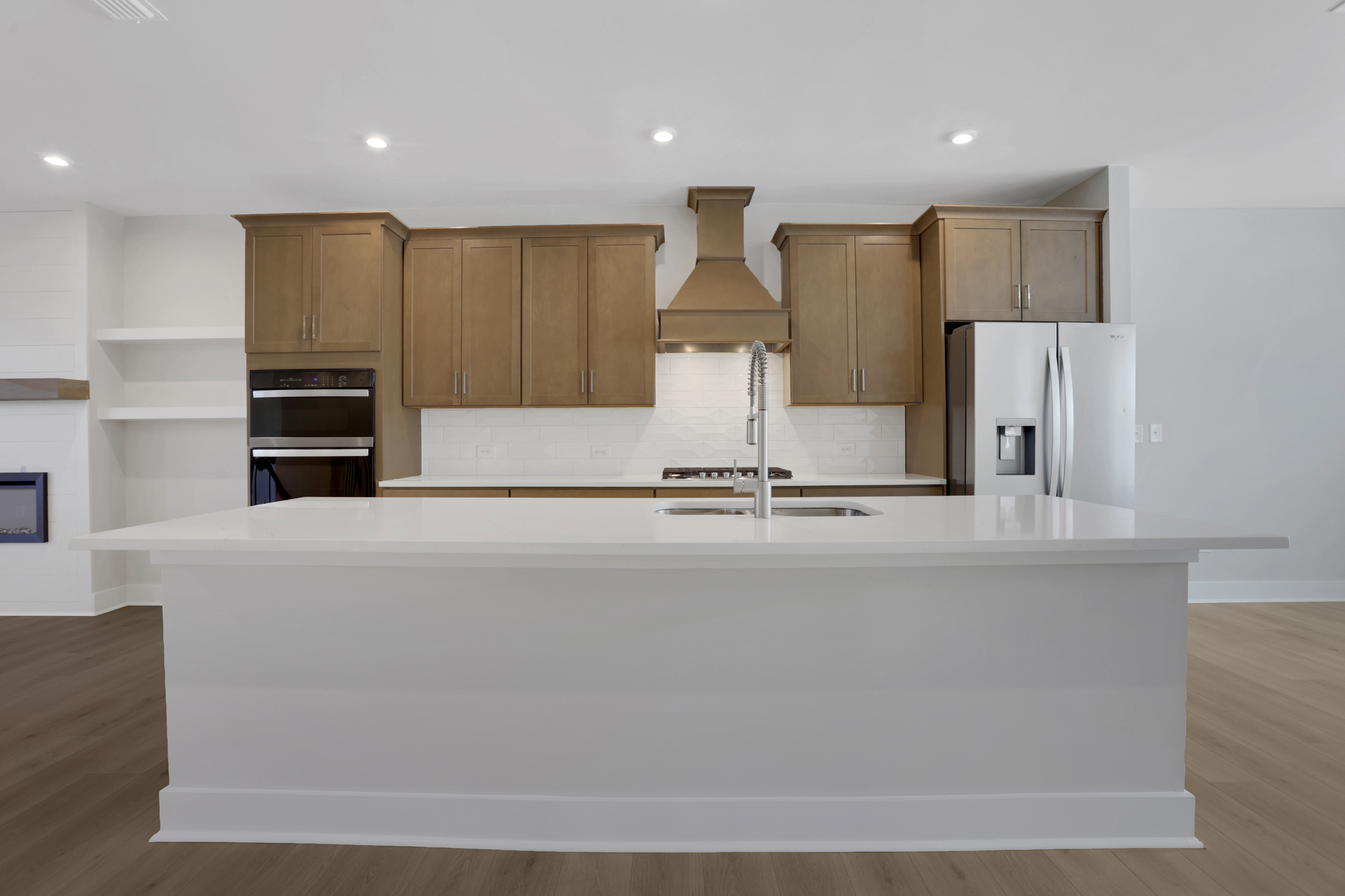 kitchen with wood-finish cabinets and white quartz counters