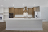 kitchen with wood-finish cabinets and white quartz counters