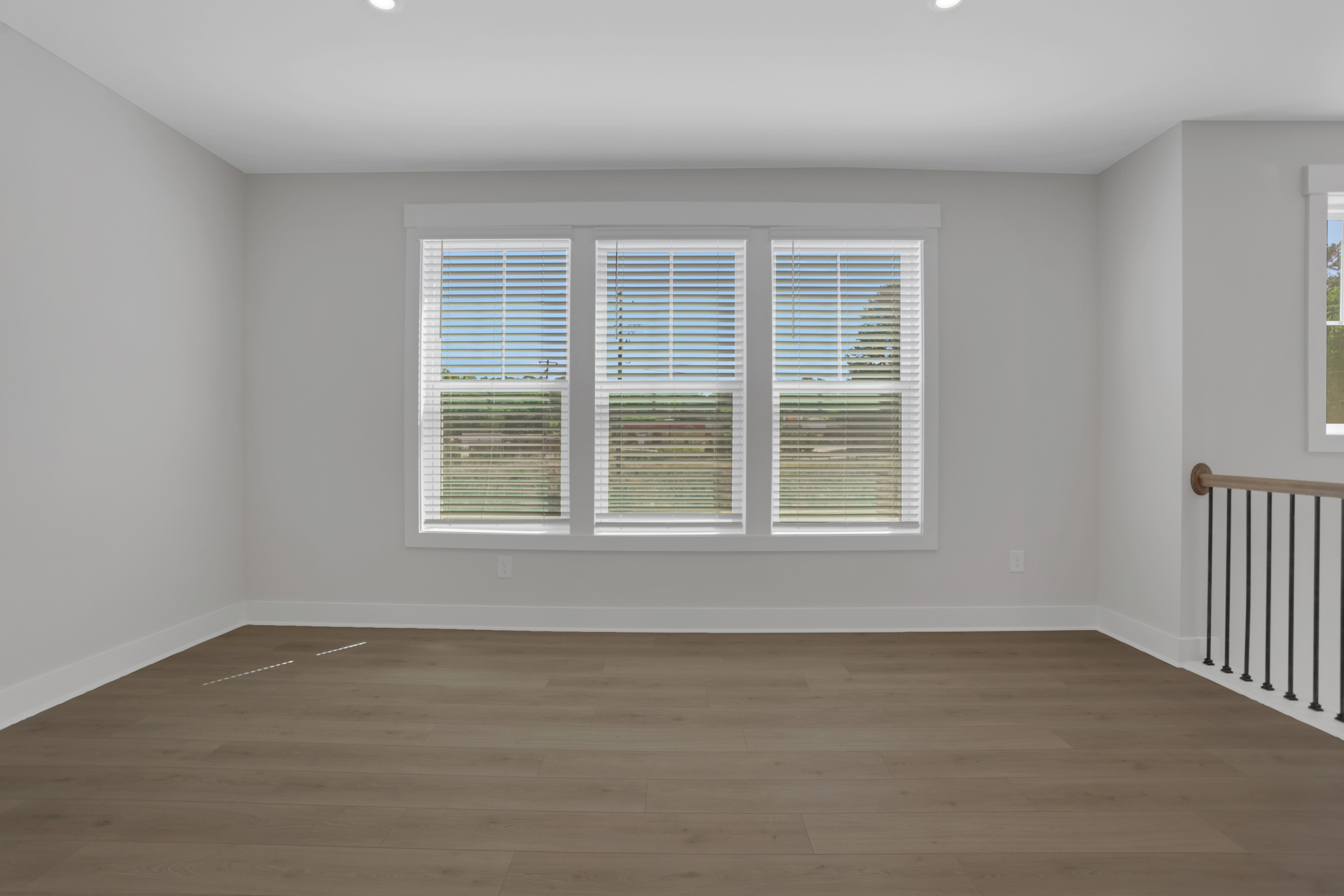 dining room with hard-surface flooring and windows