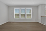 dining room with hard-surface flooring and windows