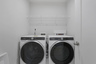 laundry room with washer and dryer
