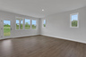 great room with hard-surface flooring open to the kitchen
