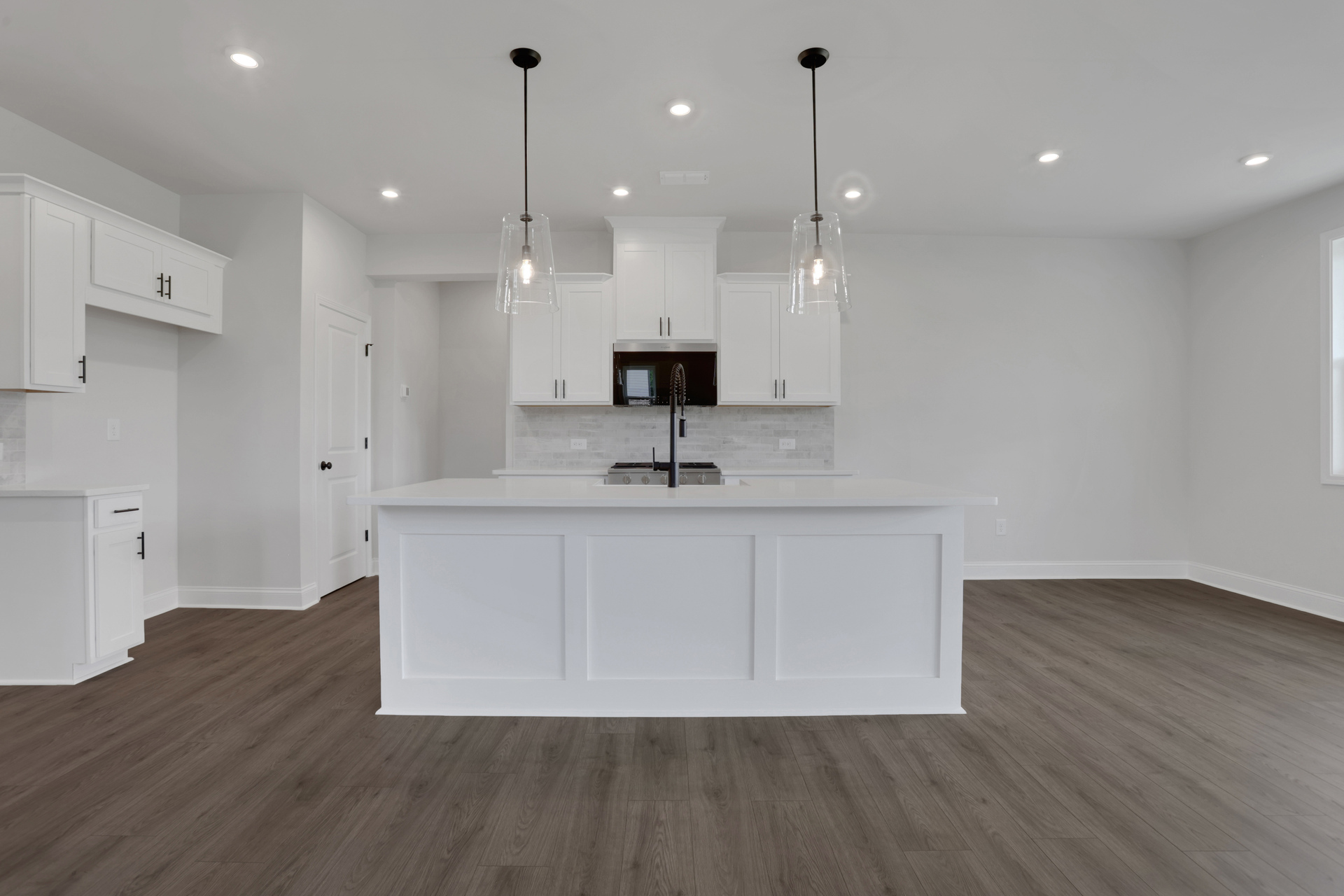 kitchen with white cabinets and white quartz counters