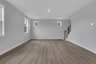 great room with hard-surface floors and windows