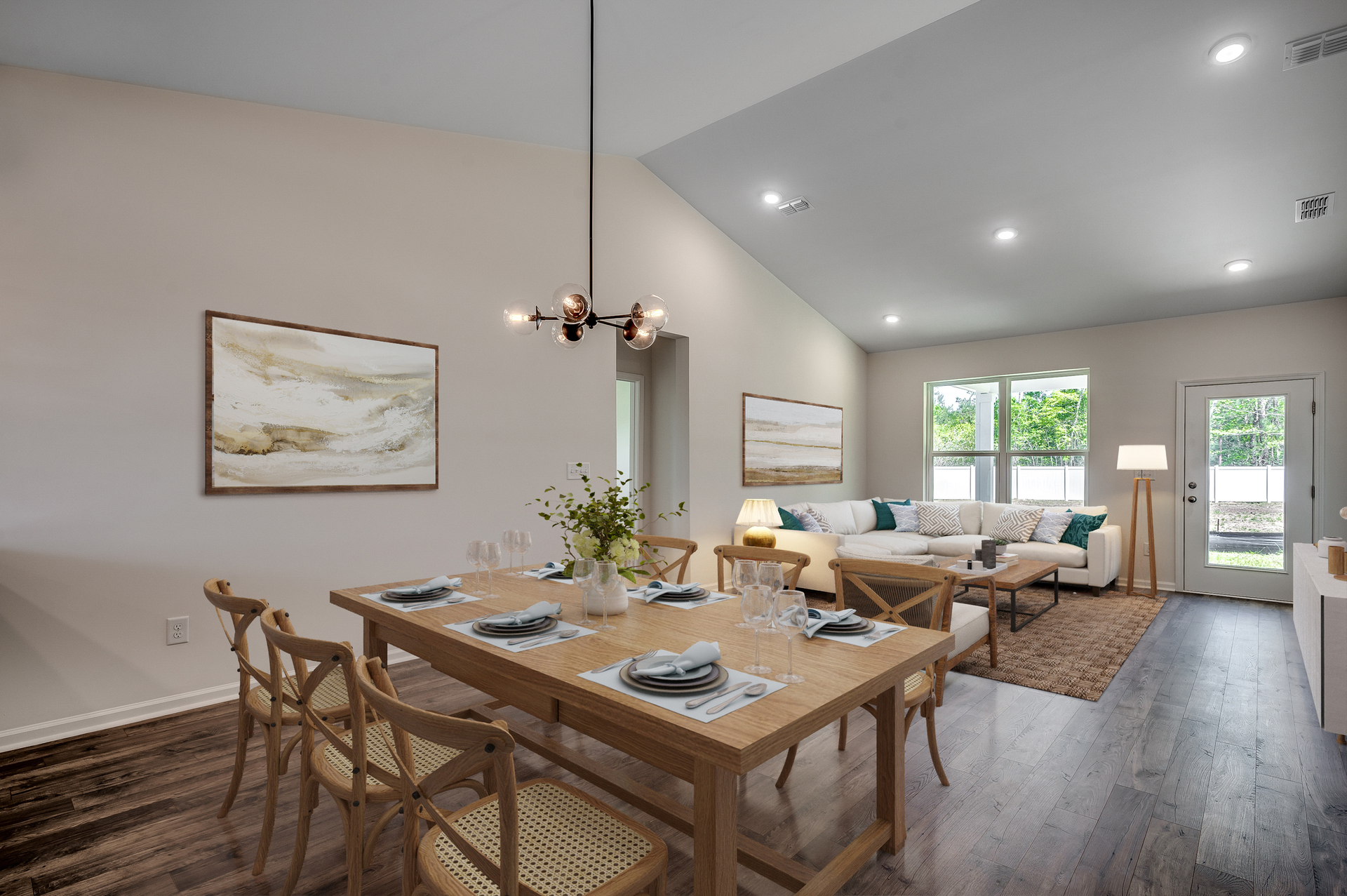 open concept area with high ceilings, hardwood flooring and puck lighting throughout 