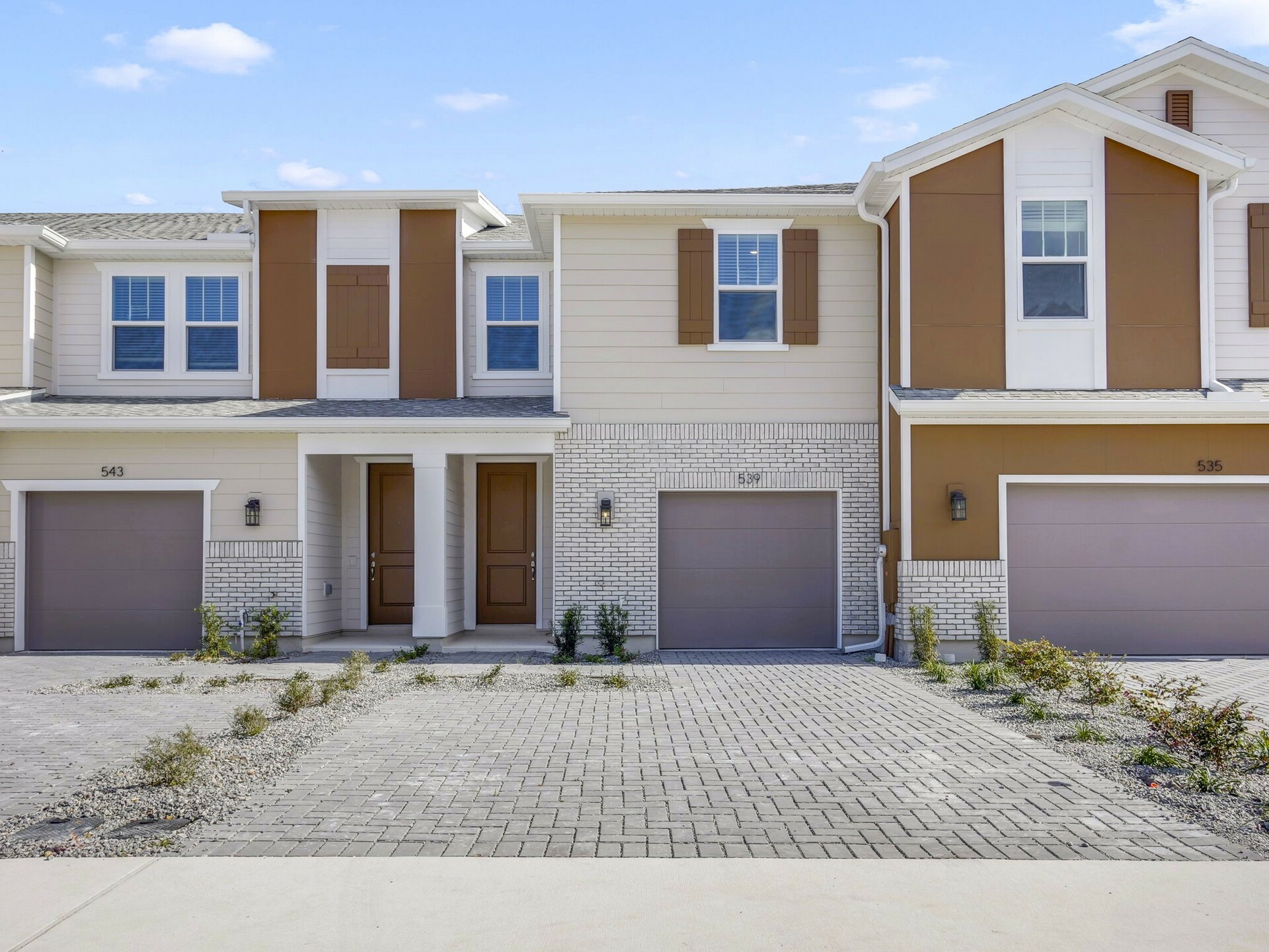 exterior of home with view of single car garage and front entrance