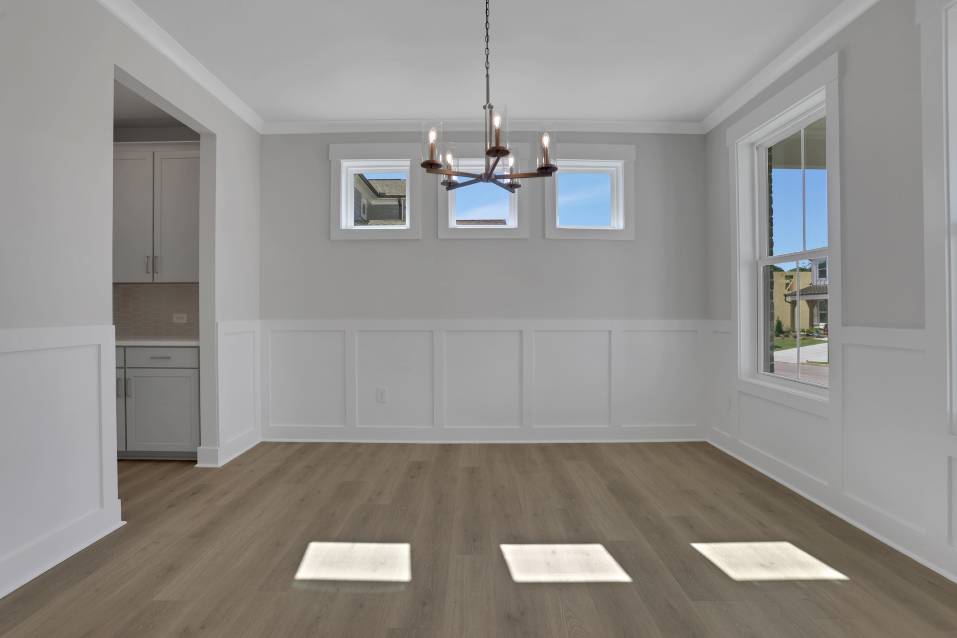 dining room with hard-surface flooring and windows